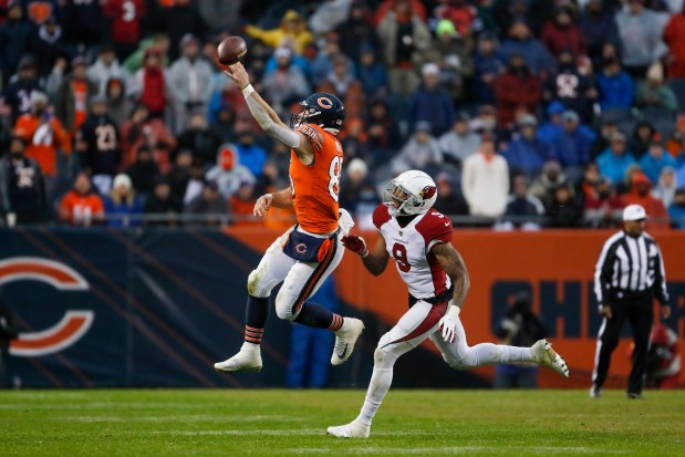 Bears tight end Cole Kmet is unable to catch a ball as Cardinals inside linebacker Isaiah Simmons defends in the fourth quarter at Soldier Field on Dec. 5, 2021. (Jose M. Osorio/ Chicago Tribune)