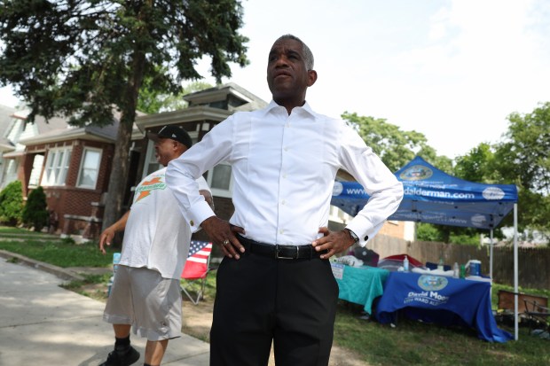 Ald. David Moore, 17th, talks with area residents in the 1200 block of West 73rd Place on Saturday, June 15, 2024, in Chicago. Moore has set up an encampment in the block to bring attention to violent crime and drug dealing in the neighborhood, with the hope his presence will lead to community and law enforcement engagement in dealing with the problems. (John J. Kim/Chicago Tribune)