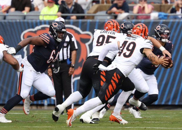 Bears guard Nate Davis (64) works to protect quarterback Caleb Williams in the first quarter against the Bengals in a preseason game at Soldier Field on Aug. 17, 2024, in Chicago. (John J. Kim/Chicago Tribune)