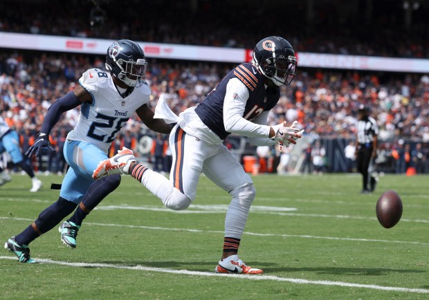 Bears wide receiver Keenan Allen can't catch a pass ahead of Titans safety Quandre Diggs in the second quarter Sunday, Sept. 8, 2024, at Soldier Field. (Brian Cassella/Chicago Tribune)