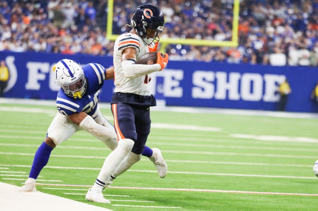 Chicago Bears wide receiver Rome Odunze (15) tries to get past Indianapolis Colts safety Nick Cross (20) during the fourth quarter of the game at Lucas Oil Stadium in Indianapolis on Sunday, Sept. 22, 2024.(Eileen T. Meslar/Chicago Tribune)