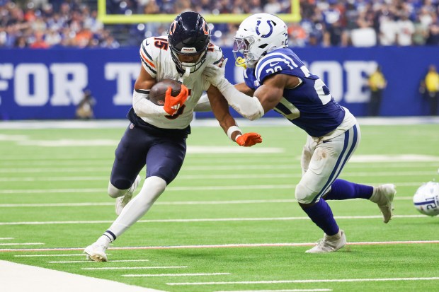 Chicago Bears wide receiver Rome Odunze (15) tries to get past Indianapolis Colts safety Nick Cross (20) during the fourth quarter of the game at Lucas Oil Stadium in Indianapolis on Sunday, Sept. 22, 2024.(Eileen T. Meslar/Chicago Tribune)