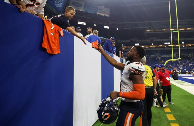 Chicago Bears safety Kevin Byard III (31) gives a fan his gloves after losing against the Indianapolis Colts 21-16 at Lucas Oil Stadium in Indianapolis on Sunday, Sept. 22, 2024.(Eileen T. Meslar/Chicago Tribune)