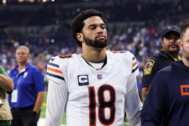 Bears quarterback Caleb Williams walks off the field after losing against the Indianapolis Colts 21-16 at Lucas Oil Stadium in Indianapolis on Sept. 22, 2024.(Eileen T. Meslar/Chicago Tribune)