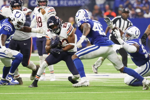 Bears running back Roschon Johnson tries to get past Indianapolis Colts linebacker E.J. Speed during the fourth quarter of the game at Lucas Oil Stadium in Indianapolis on Sept. 22, 2024.(Eileen T. Meslar/Chicago Tribune)