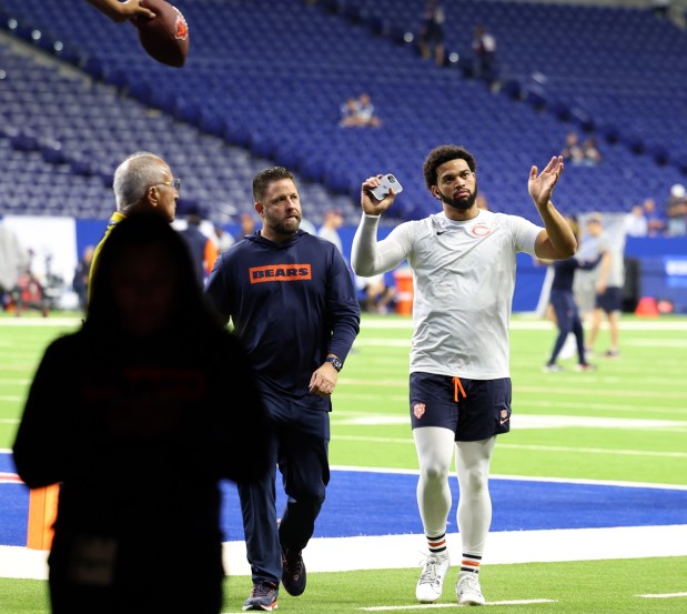 Chicago Bears quarterback Caleb Williams (18) freacts to fans as he heads off the field following warm-ups before the start of a game between the Chicago Bears and the Indianapolis Colts at Lucas Oil Stadium on Sept. 22, 2024, in Indianapolis. (Stacey Wescott/Chicago Tribune)