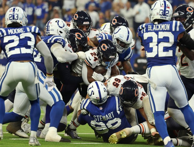 Bears running back Khalil Herbert (24) is stopped by the Colts defense while trying to score near the goal line in the second quarter at Lucas Oil Stadium on Sept. 22, 2024, in Indianapolis. (Stacey Wescott/Chicago Tribune)