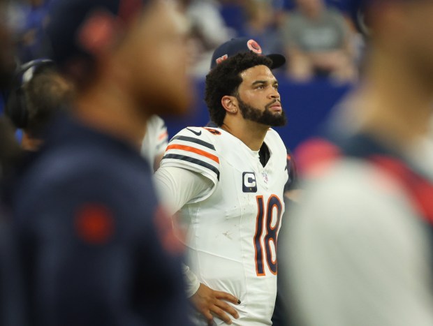 Bears quarterback Caleb Williams watches a replay of an interception he threw against the Colts on the video board on Sept. 22, 2024, at Lucas Oil Stadium in Indianapolis. (Stacey Wescott/Chicago Tribune)