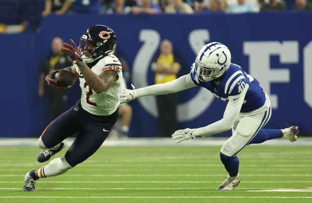 Indianapolis Colts cornerback Jaylon Jones (40) chases Chicago Bears wide receiver DJ Moore (2) after Moore catches a pass and runs for extra yards during the first quarter at Lucas Oil Stadium on Sept. 22, 2024, in Indianapolis. (Stacey Wescott/Chicago Tribune)