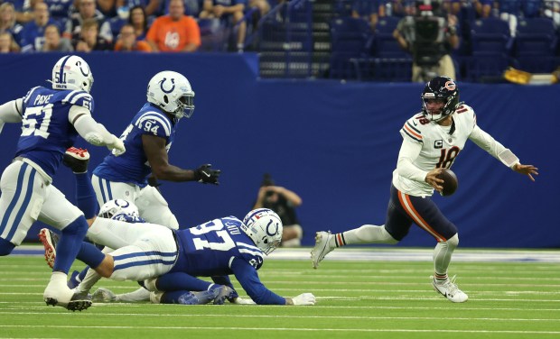 Chicago Bears quarterback Caleb Williams (18) is pressured by the Indianapolis Colts defense in the first quarter at Lucas Oil Stadium on Sept. 22, 2024, in Indianapolis. (Stacey Wescott/Chicago Tribune)