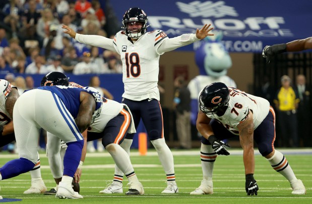 Bears quarterback Caleb Williams signals changes to his offense in the first quarter at Lucas Oil Stadium on Sept. 22, 2024, in Indianapolis. (Stacey Wescott/Chicago Tribune)