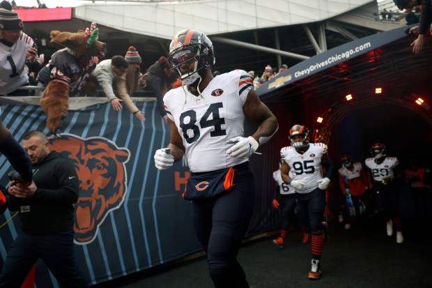 Bears tight end Marcedes Lewis runs out of the tunnel for a game against the Cardinals on Dec. 24, 2023, at Soldier Field. (Trent Sprague/Chicago Tribune)