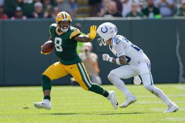 Packers running back Josh Jacobs rushes past Colts safety Rodney Thomas II on Sunday, Sept. 15, 2024, in Green Bay. (AP Photo/Matt Ludtke)