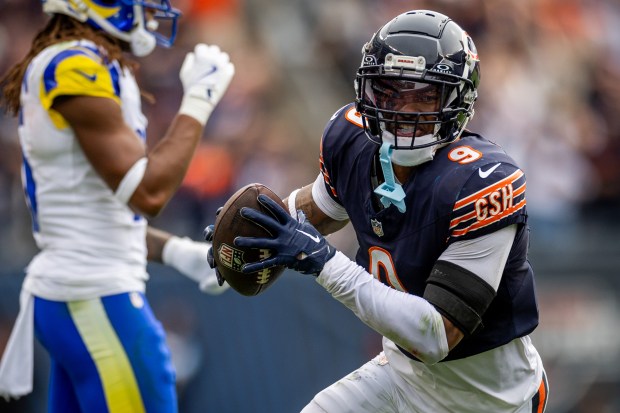 Chicago Bears safety Jaquan Brisker (9) makes an interception during the second half of the game against the Los Angeles Rams at Soldier Field. The Bears won 24-18 against the Rams. (Tess Crowley/Chicago Tribune)