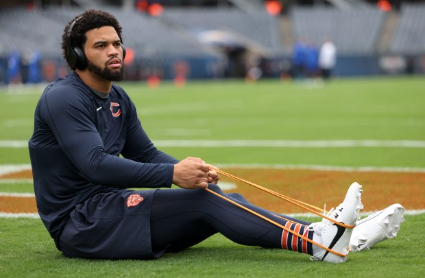 Chicago Bears quarterback Caleb Williams stretches in the end zone as he warms up to face the Los Angeles Rams on Sunday, Sept. 29, 2024, at Soldier Field. (Brian Cassella/Chicago Tribune)