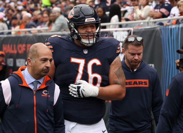 Bears guard Teven Jenkins leaves the game with an injury on Sept. 29, 2024, at Soldier Field. (Brian Cassella/Chicago Tribune)