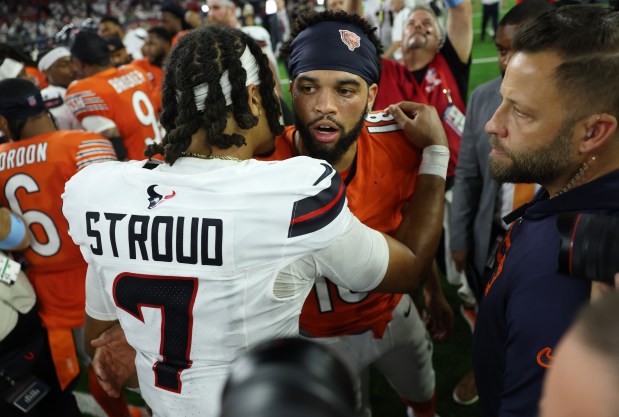 Bears quarterback Caleb Williams (18) and Texans quarterback C.J. Stroud (7) greet each other after a 19-13 Texans win at NRG Stadium on Sept. 15, 2024, in Houston. (John J. Kim/Chicago Tribune)