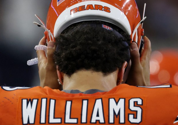 Bears quarterback Caleb Williams takes off his helmet on the sideline after getting sacked in the fourth quarter against the Texans at NRG Stadium on Sept. 15, 2024, in Houston. (John J. Kim/Chicago Tribune)