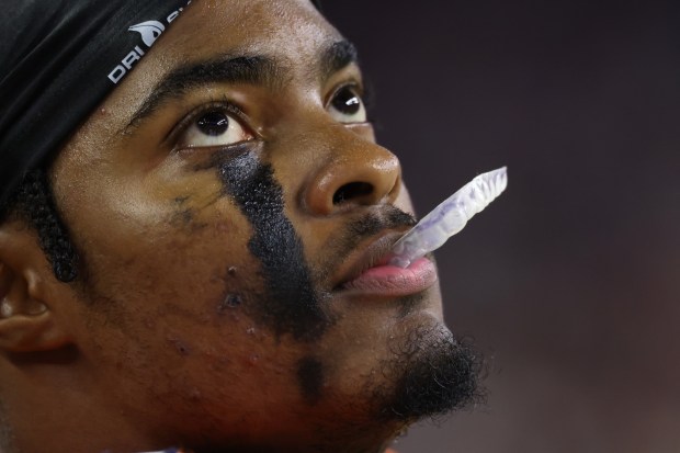 Bears safety Jaquan Brisker looks at the video board in the third quarter against the Texans at NRG Stadium on Sept. 15, 2024, in Houston. (John J. Kim/Chicago Tribune)