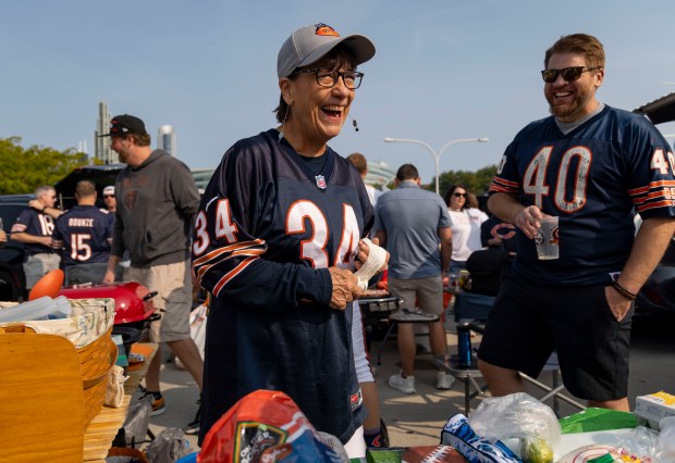 Cindy Laccino and her nephew Steven Fisher tailgate with other family members before the Chicago Bears face the Tennessee Titans in the season opener on Sunday, Sept. 8, 2024, at Soldier Field. (Brian Cassella/Chicago Tribune)