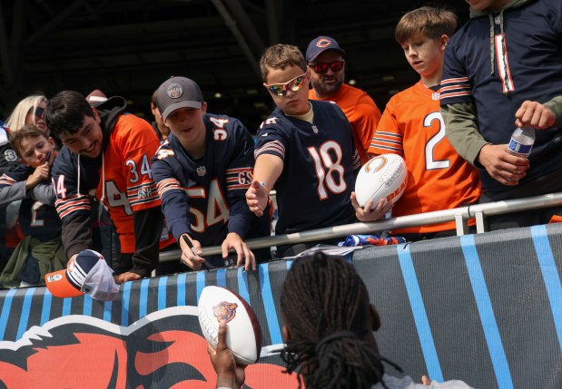 Chicago Bears fans get autographs before their team faces the Tennessee Titans on Sunday, Sept. 8, 2024, at Soldier Field. (Brian Cassella/Chicago Tribune)