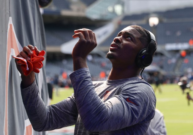 Chicago Bears safety Jaquan Brisker signs autograph for fans before the game Sunday, Sept. 8, 2024, at Soldier Field. (Brian Cassella/Chicago Tribune)