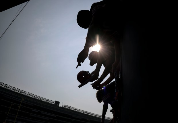 Chicago Bears fans get autographs before their team faces the Tennessee Titans on Sunday, Sept. 8, 2024, at Soldier Field. (Brian Cassella/Chicago Tribune)