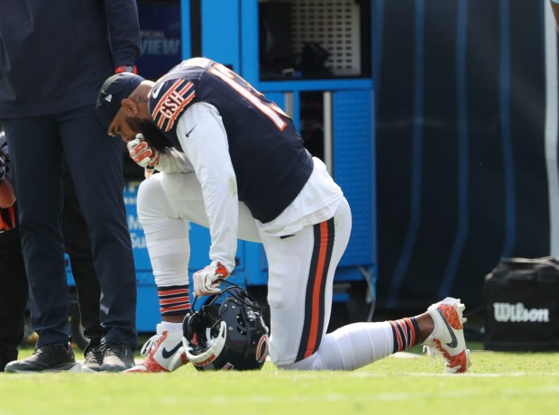 Chicago Bears wide receiver Keenan Allen (13) is shaken up after attempting to catch a pass in the fourth quarter Sunday, Sept. 8, 2024, at Soldier Field. The Bears defeated the Titans 24-17. (Brian Cassella/Chicago Tribune)