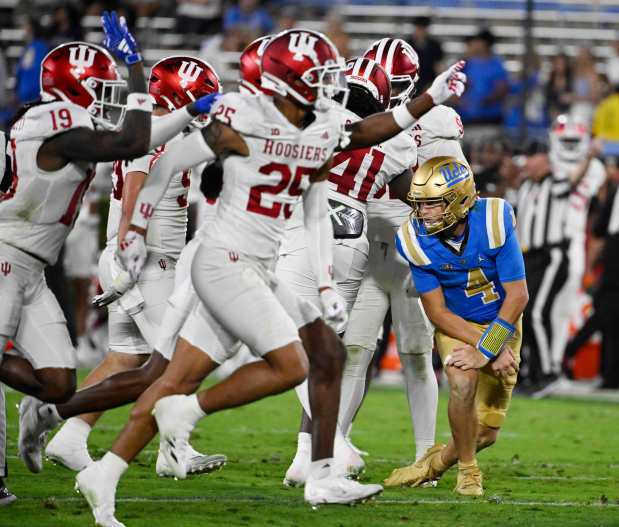 Indiana defensive back Amare Ferrell (25) runs past UCLA quarterback Ethan Garbers (4) after intercepting a pass in the second half Saturday, Sept. 14, 2024, at the Rose Bowl in Pasadena, Calif. (Keith Birmingham/Orange County Register)