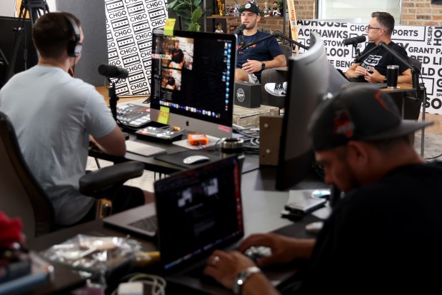 Producer Stephen Nicholas, left, records "The Eighty Five" podcast with Bears tight end Cole Kmet, center, and cohost Adam Hoge on Sept. 17, 2024, in the West Loop. (Antonio Perez/Chicago Tribune)