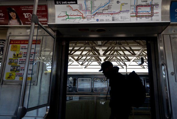 A passenger boards as a train car prepares to depart the CTA Blue Line station at Forest Park on Tuesday, Sept. 3, 2024. Four people were shot and killed on a Blue Line train in Forest Park early Monday. This was the deadliest incident of gun violence on a CTA train in decades. Cook County prosecutors charged one person Tuesday in the slayings. (Brian Cassella/Chicago Tribune)