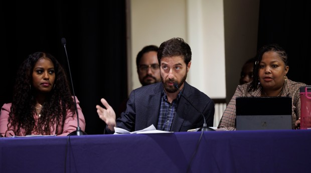 Chicago Teachers Union President Stacy Davis Gates, left, and Vice President Jackson Potter, center, attend a bargaining session on sustainable community schools with members of the Chicago Teachers Union and Chicago Public Schools at Cameron Elementary School on Sept. 24, 2024. (Armando L. Sanchez/Chicago Tribune)