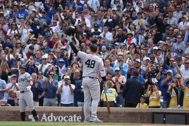 Yankees first baseman Anthony Rizzo (48) salutes the Wrigley Field crowd before a second-inning at-bat against the Cubs on Sept. 6, 2024. (Terrence Antonio James/Chicago Tribune)