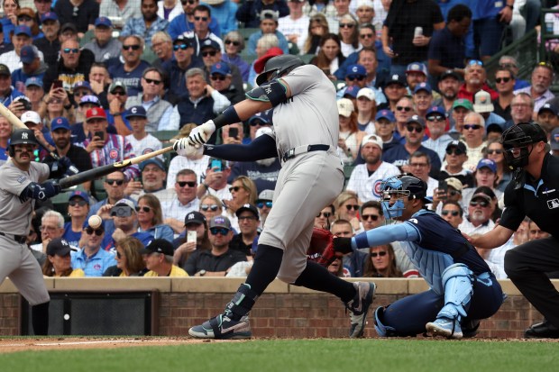 Yankees outfielder Aaron Judge (99) hits an RBI double in the third inning against the Cubs at Wrigley Field on Sept. 6, 2024. (Terrence Antonio James/Chicago Tribune)