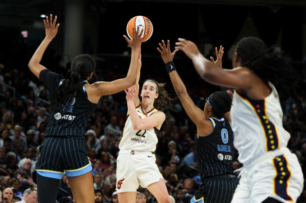 Indiana Fever guard Caitlin Clark (22) tries to get a pass through traffic during the game against the Chicago Sky at Wintrust Arena on June 23, 2024. (Eileen T. Meslar/Chicago Tribune)