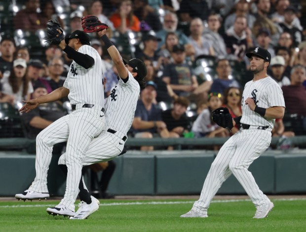 White Sox third baseman Lenyn Sosa (50), left, and shortstop Nicky Lopez (8) collide as Lopez catches a fly ball from Tigers third baseman Jace Jung in the sixth inning at Guaranteed Rate Field on Aug. 23, 2024, in Chicago. (John J. Kim/Chicago Tribune)