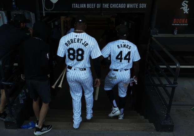 White Sox centerfielder Luis Robert Jr. (88) and third baseman Bryan Ramos (44) head to the clubhouse after a 7-0 win over the Angels at Guaranteed Rate Field on Sept. 26, 2024, in Chicago. The White Sox swept the series 3-0. (John J. Kim/Chicago Tribune)