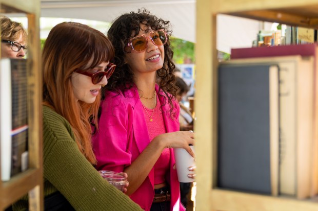 Cindy Thompson, center, and Megan Lane, left, browse books at the 39th Annual Printers Row Lit Fest on Sept. 7, 2024. (Tess Crowley/Chicago Tribune)