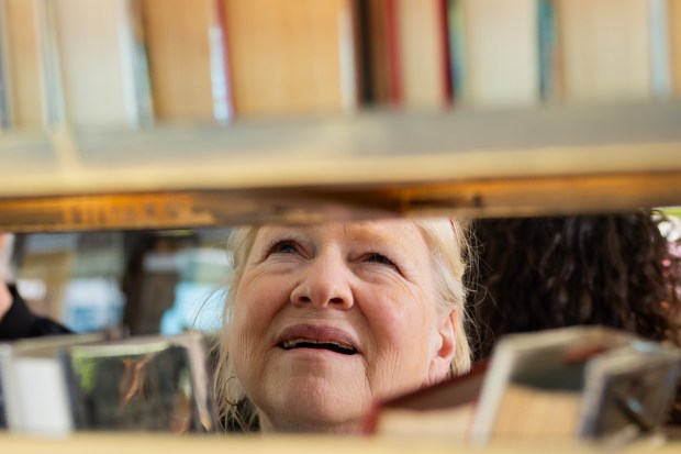 Elizabeth Murphy, of Skokie, browses books at the 39th Annual Printers Row Lit Fest on Sept. 7, 2024. (Tess Crowley/Chicago Tribune)