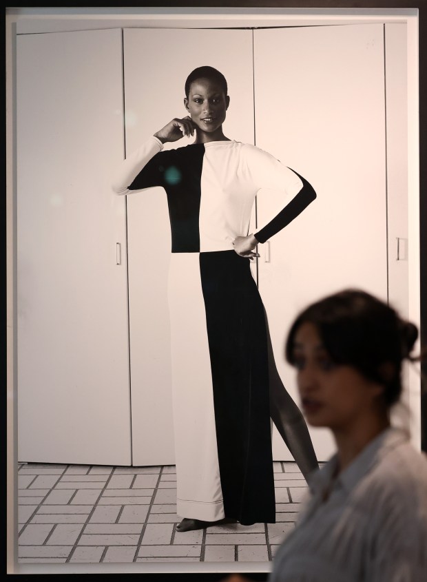 Sabina Bokhari, director of special projects at the Theaster Gates Studio and Foundation, stands near a framed photographic print included in the exhibition, "When Clouds Roll Away: Reflection and Restoration from the Johnson Archive," at the Stony Island Arts Bank. (John J. Kim/Chicago Tribune)