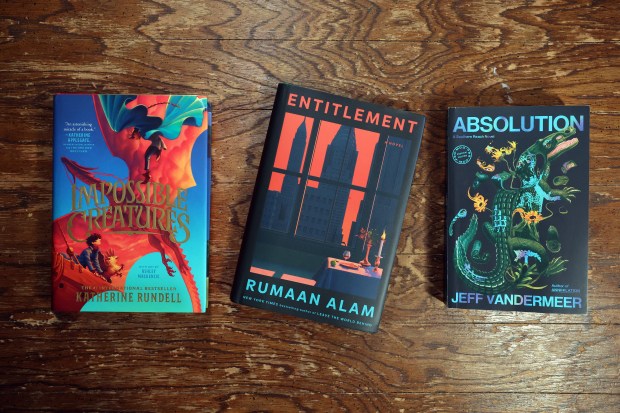 "Impossible Creatures" by Katherine Rundell, "Entitlement" by Rumaan Alam and "Absolution: A Southern Reach Novel" by Jeff VanderMeer. (Terrence Antonio James/Chicago Tribune)