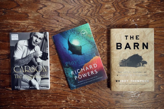 "Carson the Magnificent" by Bill Zehme, "Playground" by Richard Powers and "The Barn" by Wright Thompson. (Terrence Antonio James/Chicago Tribune)