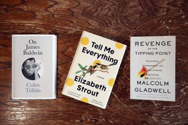 "On James Baldwin" by Colm Tóibín, "Tell Me Everything" by Elizabeth Strout and "Revenge of the Tipping Point" by Malcolm Gladwell. (Terrence Antonio James/Chicago Tribune)