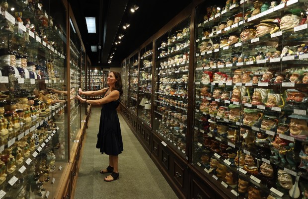 Beth Mullins Scales, the daughter of Steve Mullins who founded the American Toby Jug Museum, walks through the museum in Evanston on Sept. 17, 2024. There are over 8000 items inside of the museum which is set to close next spring. The museum was founded by Steve Mullins, an avid collector and historian of Toby jugs. (Stacey Wescott/Chicago Tribune)