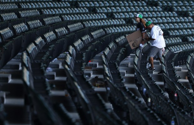 Two fans head for the exit after a 7-0 White Sox win over the Angels in the final home game of the season at Guaranteed Rate Field on Sept. 26, 2024. (John J. Kim/Chicago Tribune)