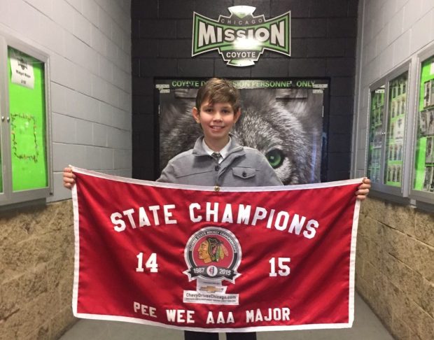 Landon Slaggert, now a Blackhawks prospect, holds a banner after winning a state championship in 2015 with a Chicago Mission team coached by Anders Sorensen, now the Rockford IceHogs coach. (Handout from Andy Slaggert)