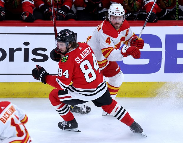 Blackhawks left wing Landon Slaggert (84) keeps his eyes on the puck against the Flames on March 26, 2024, at the United Center. (Chris Sweda/Chicago Tribune)