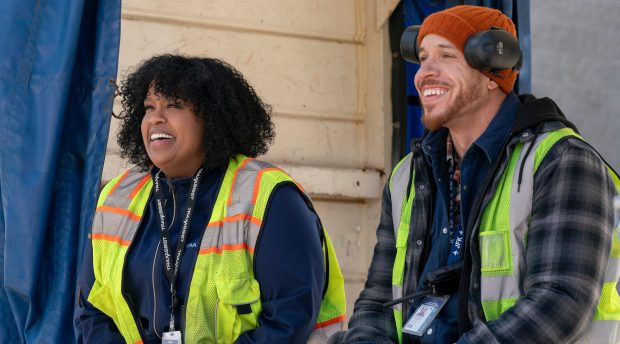 From left: Natasha Rothwell and Keilyn Durrel Jones as airport coworkers and maybe something more - in a scene from "How to Die Alone." (John Medland/Hulu)