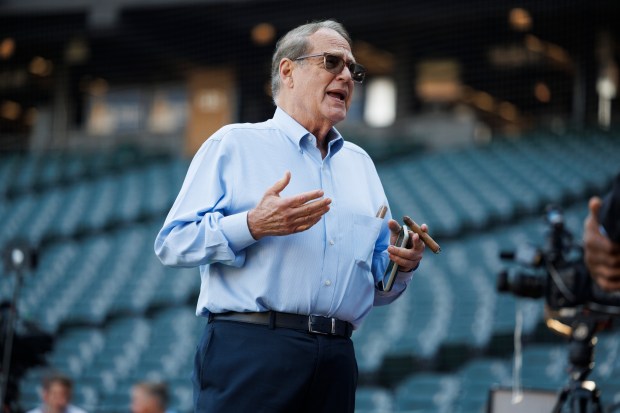 Chairman Jerry Reinsdorf smokes a cigar during warm ups before the White Sox play the New York Yankees at Guaranteed Rate Field Monday, Aug. 7, 2023 in Chicago. (Armando L. Sanchez/Chicago Tribune)