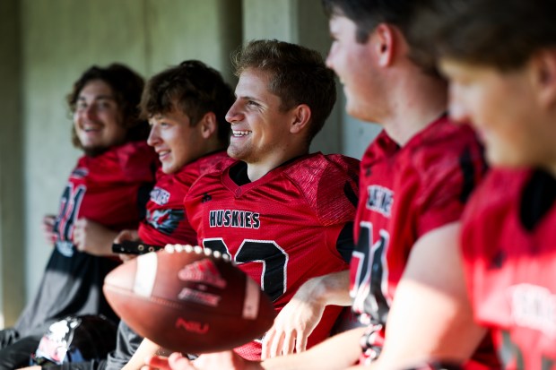 Northern Illinois kicker Kanon Woodill sits with teammates during practice on Tuesday, Sept. 17, 2024, at Huskie Stadium in DeKalb, Ill. (Eileen T. Meslar/Chicago Tribune)